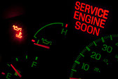 Car dashboard highlighting Service engine